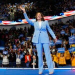 Vice President Kamala Harris waves during a campaign rally.