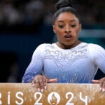 Simone Biles, of the United States, pauses after falling during the women's artistic gymnastics individual balance beam finals at Bercy Arena at the 2024 Summer Olympics.