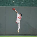Boston Red Sox center fielder Ceddanne Rafaela leaps high to make a catch on a fly ball off the bat of Kansas City Royals' Maikel Garcia during the fifth inning of a baseball game, Monday, Aug. 5, 2024, in Kansas City, Mo.