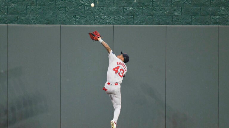 Boston Red Sox center fielder Ceddanne Rafaela leaps high to make a catch on a fly ball off the bat of Kansas City Royals' Maikel Garcia during the fifth inning of a baseball game, Monday, Aug. 5, 2024, in Kansas City, Mo.