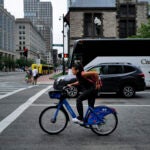 A cyclist in Copley Square.