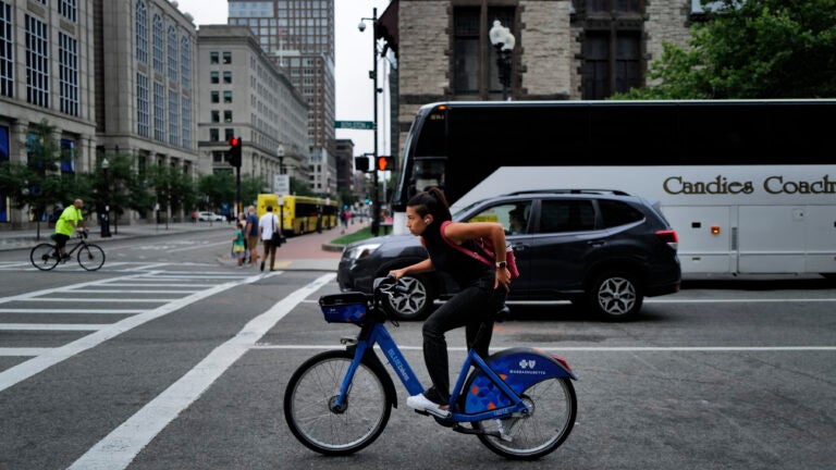 A cyclist in Copley Square.